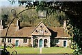 Milton Abbey: almshouses through churchyard gate