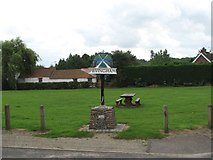TG1921 : Hevingham Village Sign and Green by Evelyn Simak