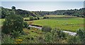 Bervie Water with sheep grazing in valley field