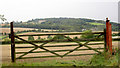 Field gate with Wentworth Castle in the background.