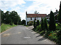 Southeast past houses on Tithe Barn Lane