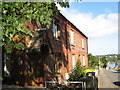 A terrace of red brick houses near the site of the old Menai Bridge railway station.