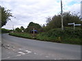 Road junction & field with remnants of summer fete