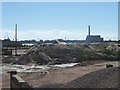 Piles of aggregate on the east bank of the River Usk