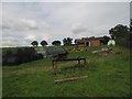 Bale stack and equipment near Collfryn