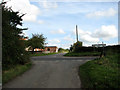 Approaching junction of Cemetery Lane with Thursford Road