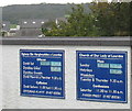 Bilingual notice boards outside Our Lady of Lourdes, Beach Road