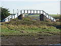 NX9929 : Footbridge over railway by H Stamper