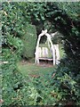 Rustic seat in Mirehouse gardens