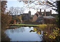 Pond at Aldham Hall with the church in the next square