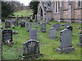 NY7756 : The churchyard of Holy Trinity Church, Whitfield by Mike Quinn