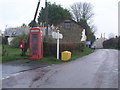 Stoke Rivers telephone kiosk looking up street