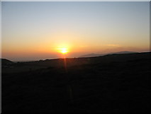 SH3031 : The sun setting between Foel Gron and Mynytho Common by Eric Jones