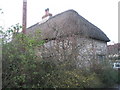 Thatched cottage on northern grid square boundary