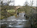 River Esk in spate near railway viaduct