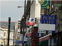 TQ2577 : Signs of the Times - North End Road, SW6 by Phillip Perry