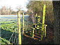 Burntcommon: Stile on footpath to Gambles Lane