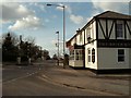 A road junction by The Brick & Tile public house