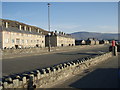 A promenade council estate with Braich Ddu in the distance