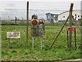 Signs on fenced off storage area