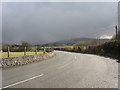 Sharp bend on the Bethel to Llanrug road just before a hail shower