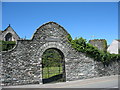 Arched gate from the A5 to the cemetery garden of St Cybi