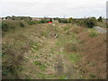 Looking NW along dismantled railway line near Nash Road