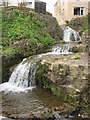 Waterfall cascading down the stepped cliff