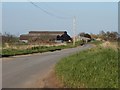 TL8818 : A view of Yew Tree Farm along New Road by Robert Edwards