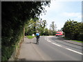 Cyclist approaching junction of Bepton Lane and New Road