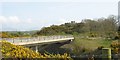 A modern road bridge and a Victorian mock castle