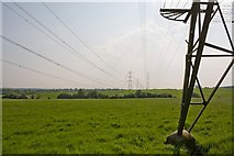 SU4119 : Double line of pylons near woodland named The Rough by Peter Facey