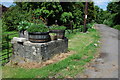 Milk churn stand at Weeke