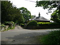 Lodge and entrance to Grittleton Stables.