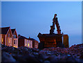 Pushing the shingle back to the sea