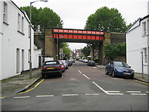TQ2475 : Putney: Esmond Street railway bridge by Nigel Cox