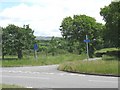 Entrance to an access road which links a number of farms to the main road.