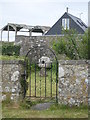 Millstone in the garden at Higher Bosistow Farm