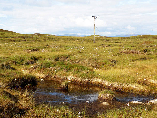 Electricity Pole Crossing the soggy peat, as seen at the forefront of the photograph