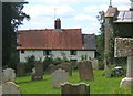TM2984 : Churchyard and Church Cottage, St Cross South Elmham by Andrew Hill
