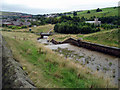 Looking down the bywash from Cowm Reservoir