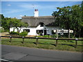 Pulloxhill: The village sign and The Old Smithy