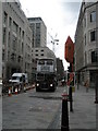 Bus negotiating a traffic light free Cannon Street