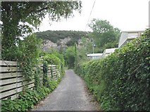 SH5381 : Path through caravan site with the Castell-mawr outcrop in the background by Eric Jones
