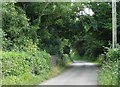 Approaching the bridge over old railway line from the Llanbedrgoch direction