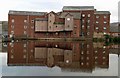 Allinsons Mill reflected in the River Aire