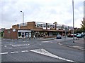 Guildford Avenue shops & pharmacy & mini-roundabout, Lawn