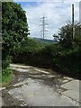 Pylon and junction of land and entrance to Bryn Cynan Farm