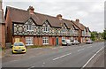 SU4225 : Decorated facades on houses along A3090 at Hursley by Peter Facey