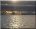 SX9574 : Sun over sea, Holcombe by Derek Harper